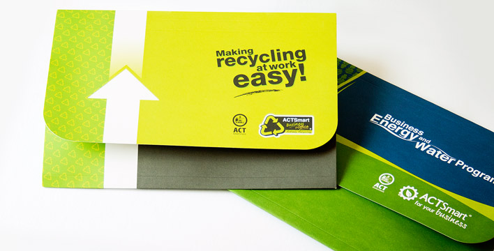 The two promotional wallets for ACTSmart's programs draws on elements of ACTSmarts branding using greens, greys and blues. Left to right: Recycling at Work and Business Energy and Water Program.