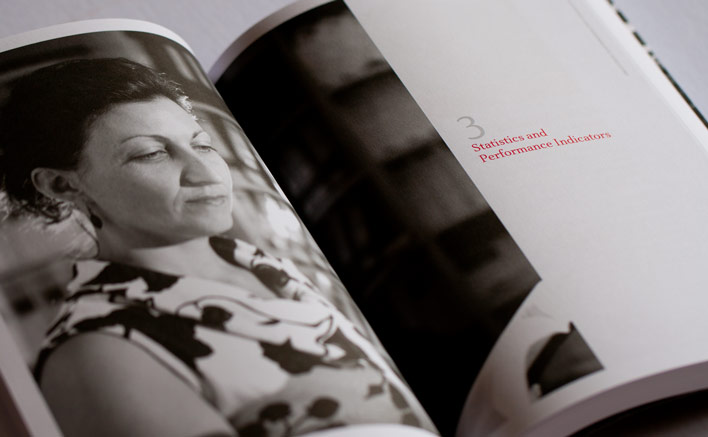 A section start from the CDPP Annual Report uses a large photograph across the spread and an elegant serif typeface with white space to allow the pages to breath.