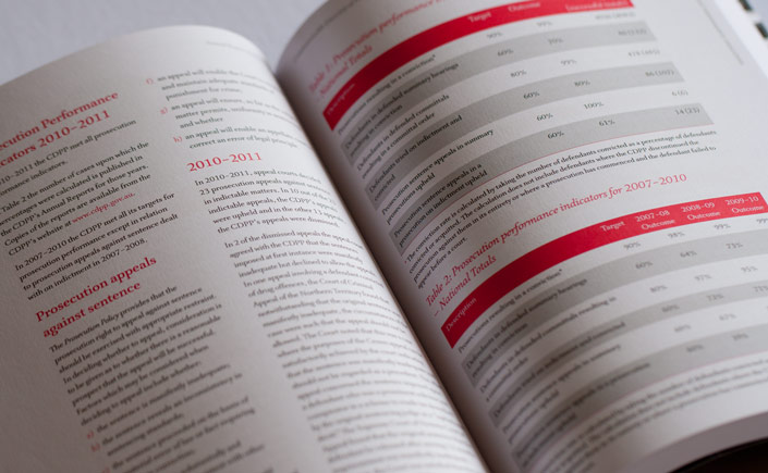 A double page spread with long text and tables. Complying with reporting guidelines, this annual report is printed in two colours - black and a Pantone red - with no bleed.
