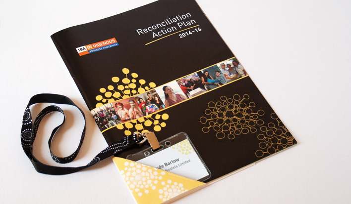 Front cover of IBA's Reconciliation Action Plan, including folded program that slipped over the corner of the magazine and held a guest name-tag